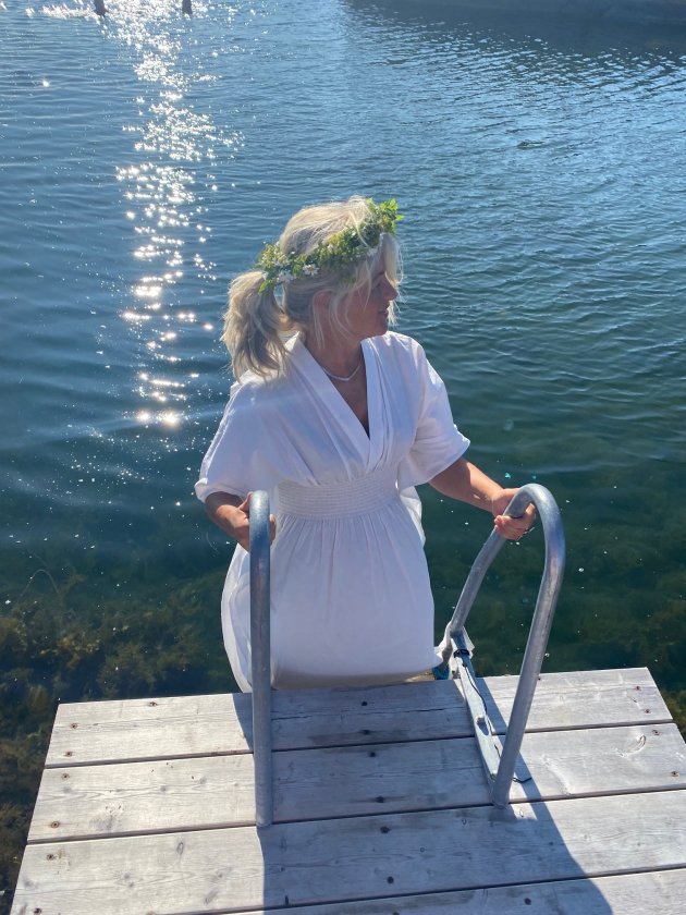 Midsummer girl with flowers in her hair